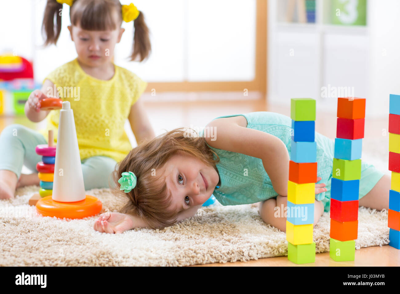 Children playing with toys in kindergarten Stock Photo