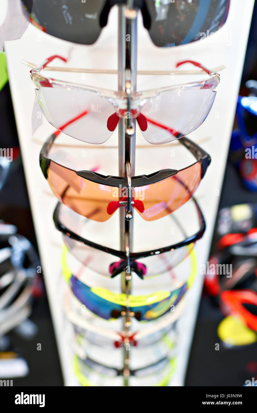 Sports glasses for cycling in storefront of shop Stock Photo