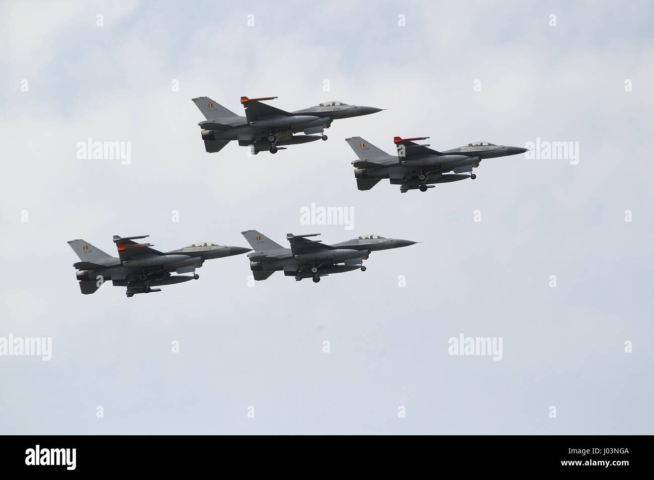 Four F-16 fighter jets of the Belgian Air Component in a flyover. Stock Photo