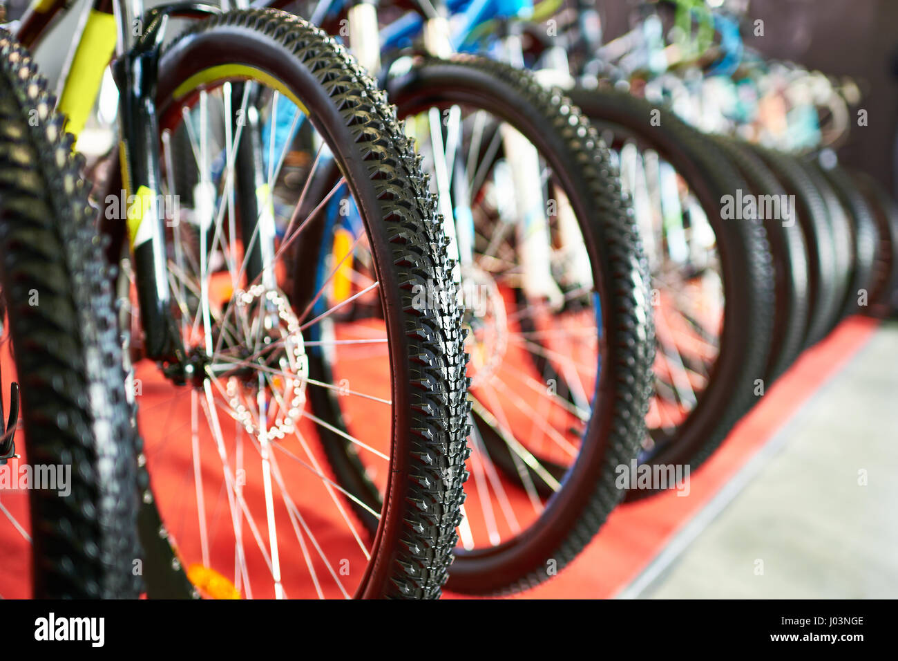 Row modern mountain bikes in sports shop Stock Photo - Alamy