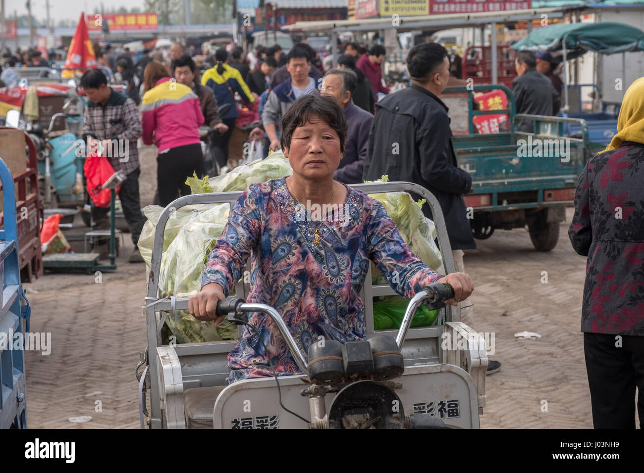 A woman ride an auto-rickshaw in Xiong County, one of the three counties composing Xiongan New Area in Hebei Province, China on April 09, 2 Stock Photo