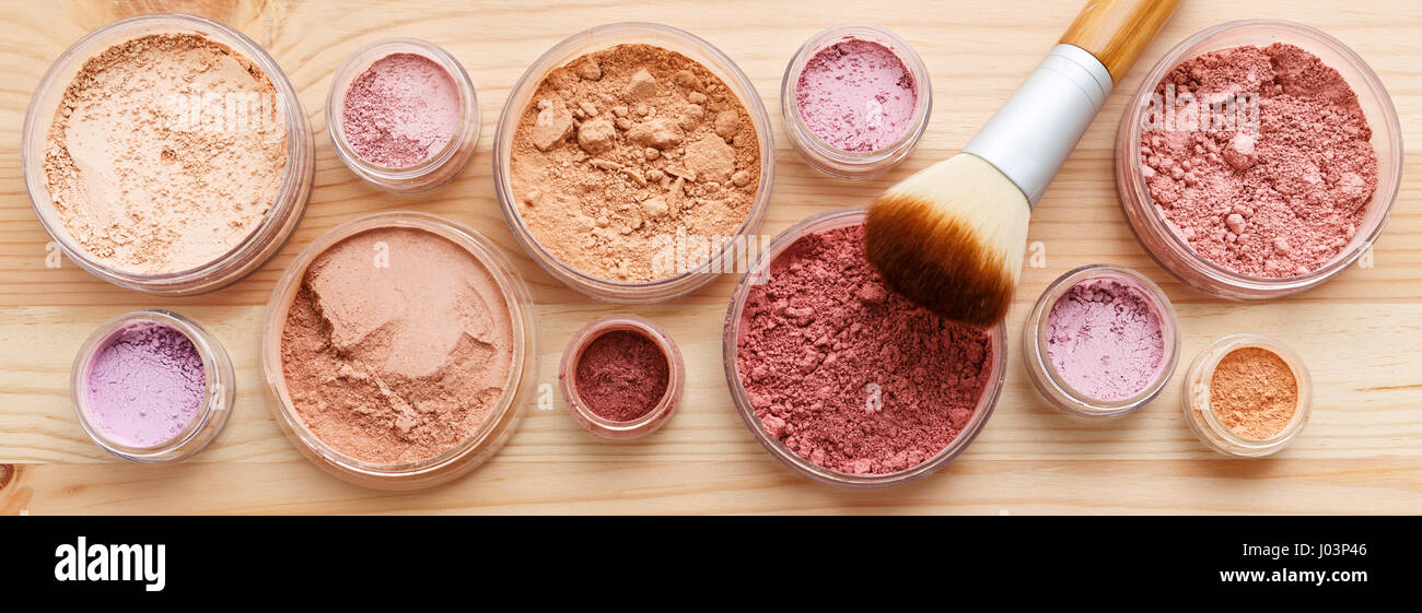 Makeup powder products with foundation blush and brush Stock Photo