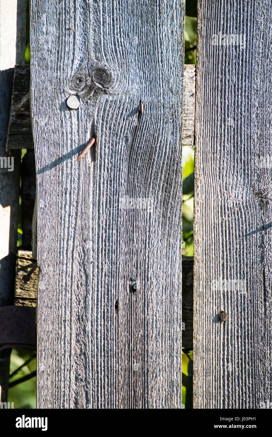 old wooden fence with barbed wire on top Stock Photo - Alamy