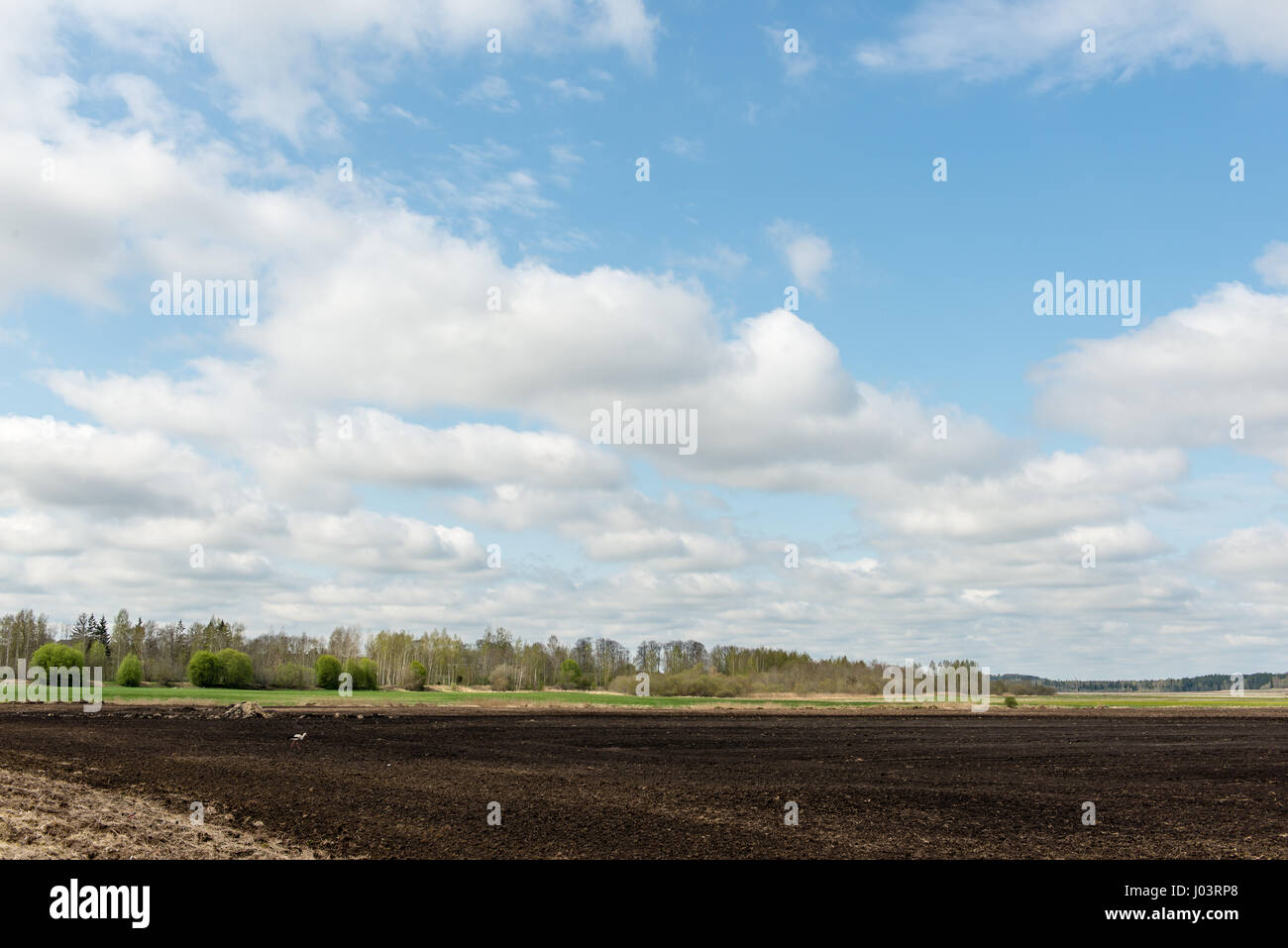 countryside fields in early spring with clouds and farmland Stock Photo ...