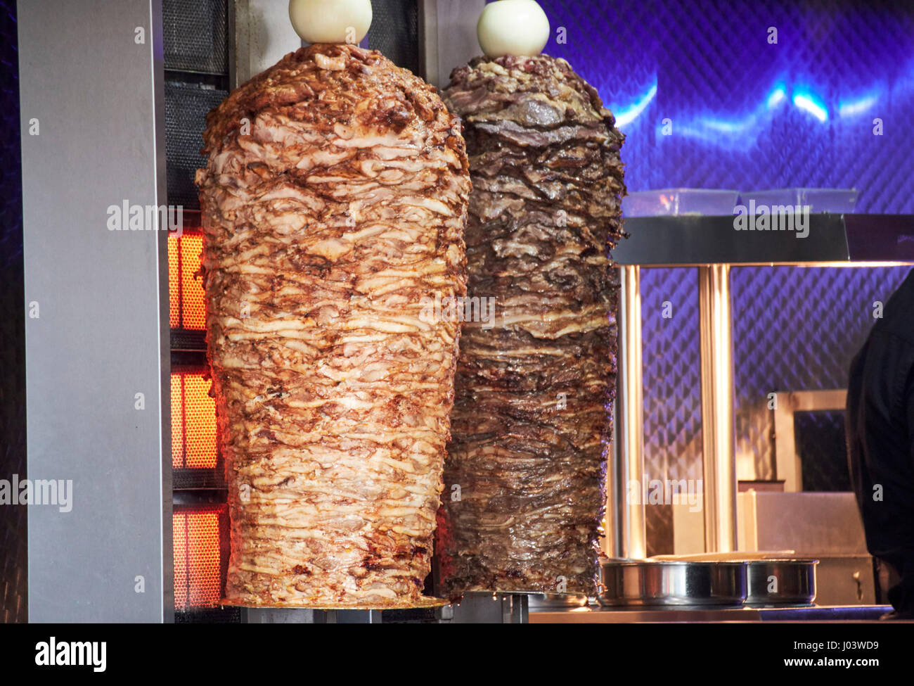 cooking kebab meat chicken and lamb in a fast food store Liverpool UK Stock Photo