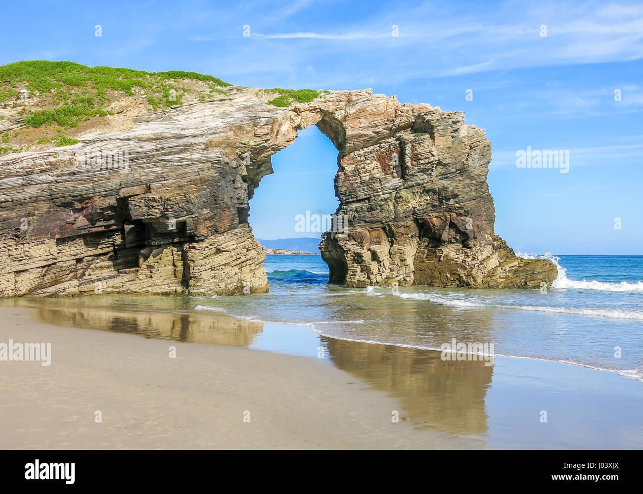 Scenic view of Praia das Catedrais, illustrating the importance of a unique business identity, much like how this beach stands out with its natural cathedral-like formations