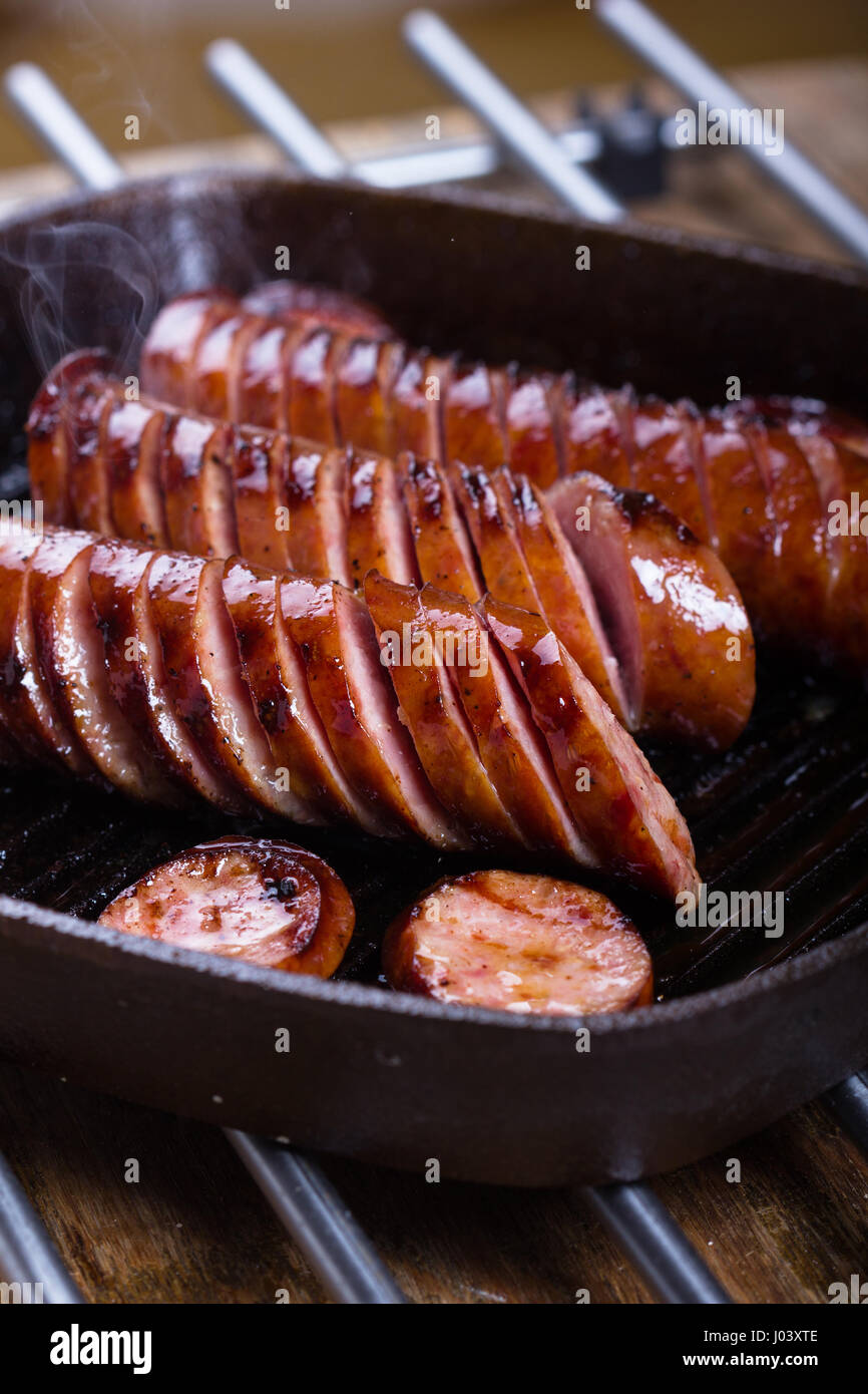 Polish traditional sausages fried on a cast iron skillet Stock Photo Alamy