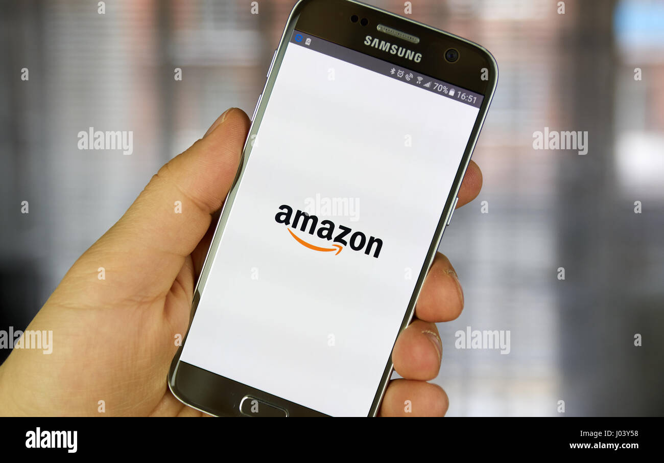 MONTREAL, CANADA - MARCH 20, 2017 - Amazon mobile application on screen of Samsung S5 in hand. Amazon is an American electronic commerce and cloud com Stock Photo