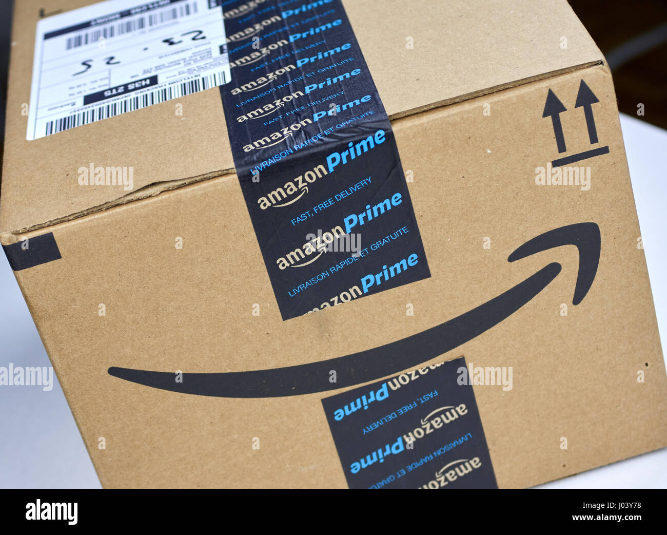 MONTREAL, CANADA - MARCH 28, 2017: Amazon Prime shipping box with branded tape on it. Amazon is an American electronic commerce and cloud computing co Stock Photo