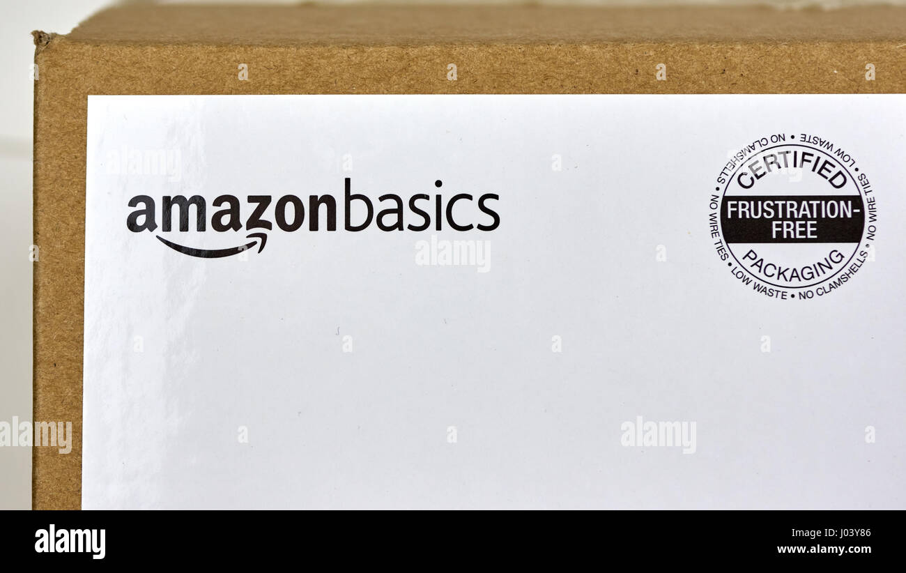 MONTREAL, CANADA - MARCH 28, 2017: Amazon Basics shipping box with branded label on it. Amazon is an American electronic commerce and cloud computing  Stock Photo