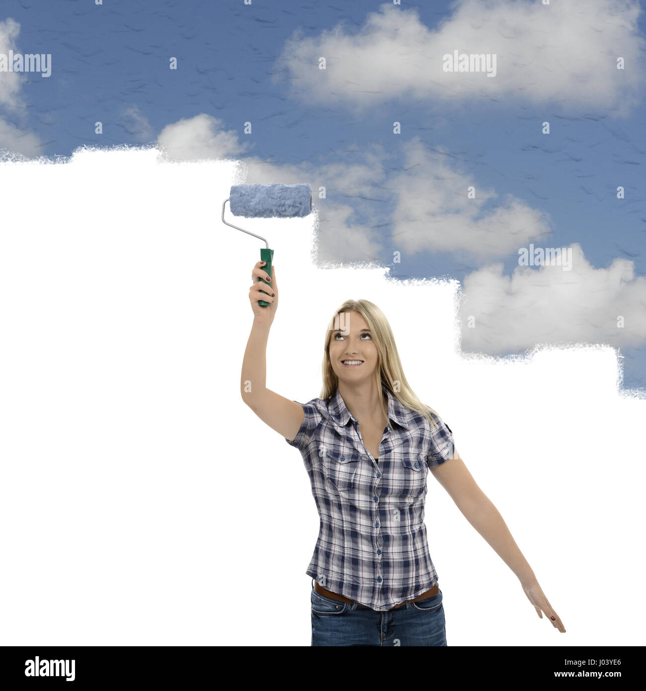 Woman painting decorating tranquil sky with clouds Stock Photo