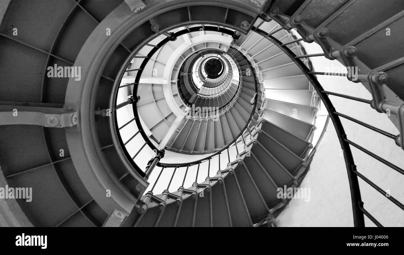 Interior view looking up a black and white spiral staircase Stock Photo