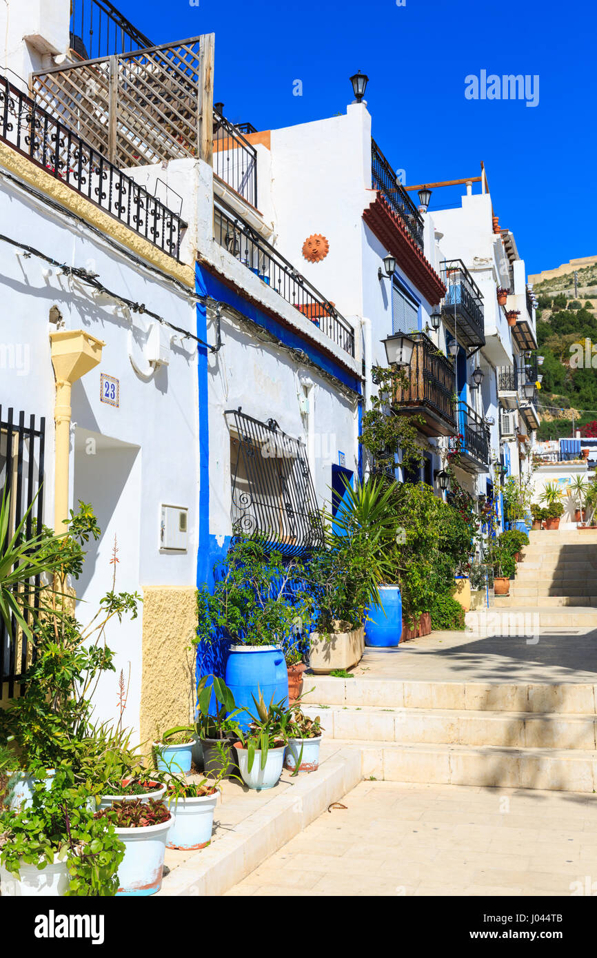 Typical Street with whitewashed Mediterranean houses, Alicante Old Town, Costa Blanca, Spain Stock Photo