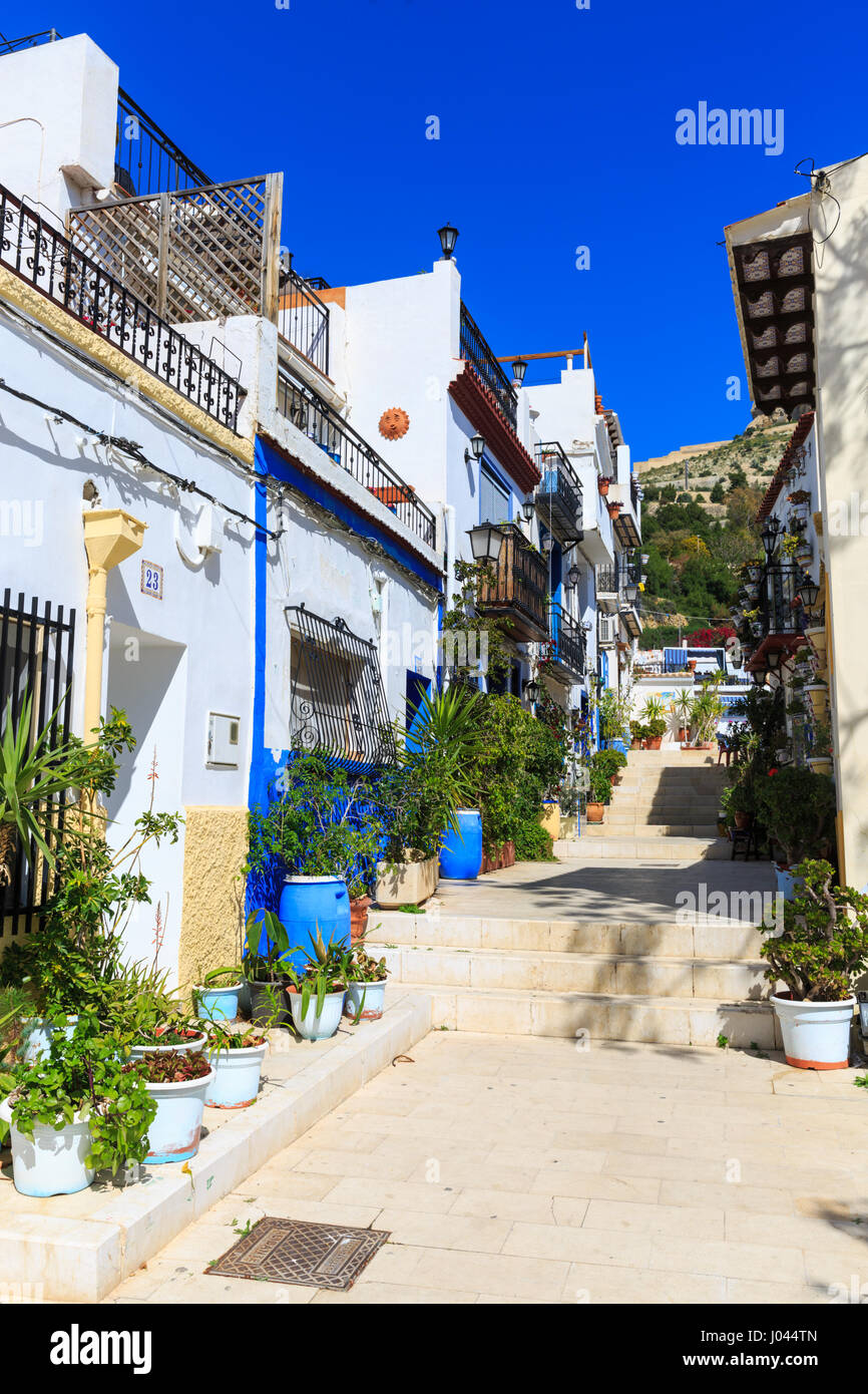 Typical Street with whitewashed Mediterranean houses, Alicante Old Town, Costa Blanca, Spain Stock Photo