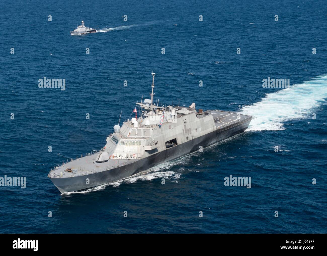 The USN Freedom-class littoral combat ship USS Fort Worth steams in formation with Royal Cambodian Navy ships November 18, 2015 in the South China Sea.                                                                                                                                                                                                                                                                                                                                                                                                          (photo by MCS2 Antonio Turrettto Ramos /US Navy  via Pl Stock Photo