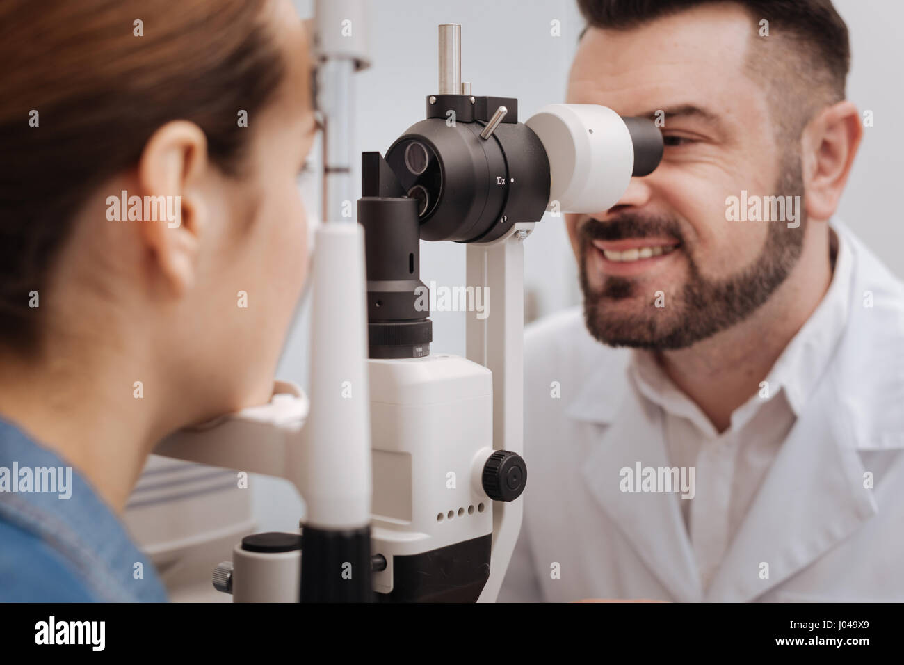Delighted cheerful doctor looking into the lens Stock Photo - Alamy