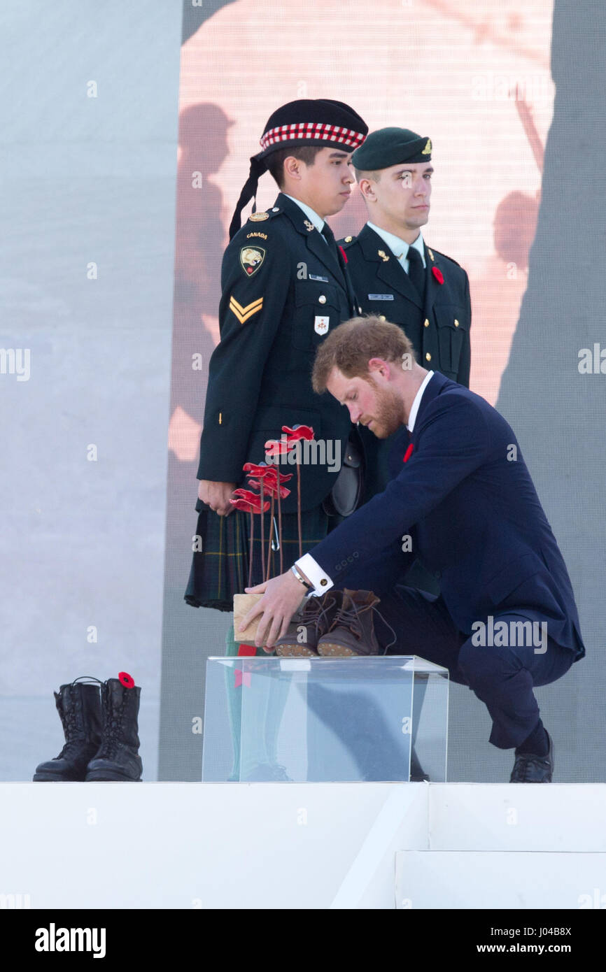 Prince Harry lays boots and a poppies of remembrance at Vimy Memorial Park in France, during commemorations for the 100th anniversary of the Battle of Vimy Ridge. Stock Photo