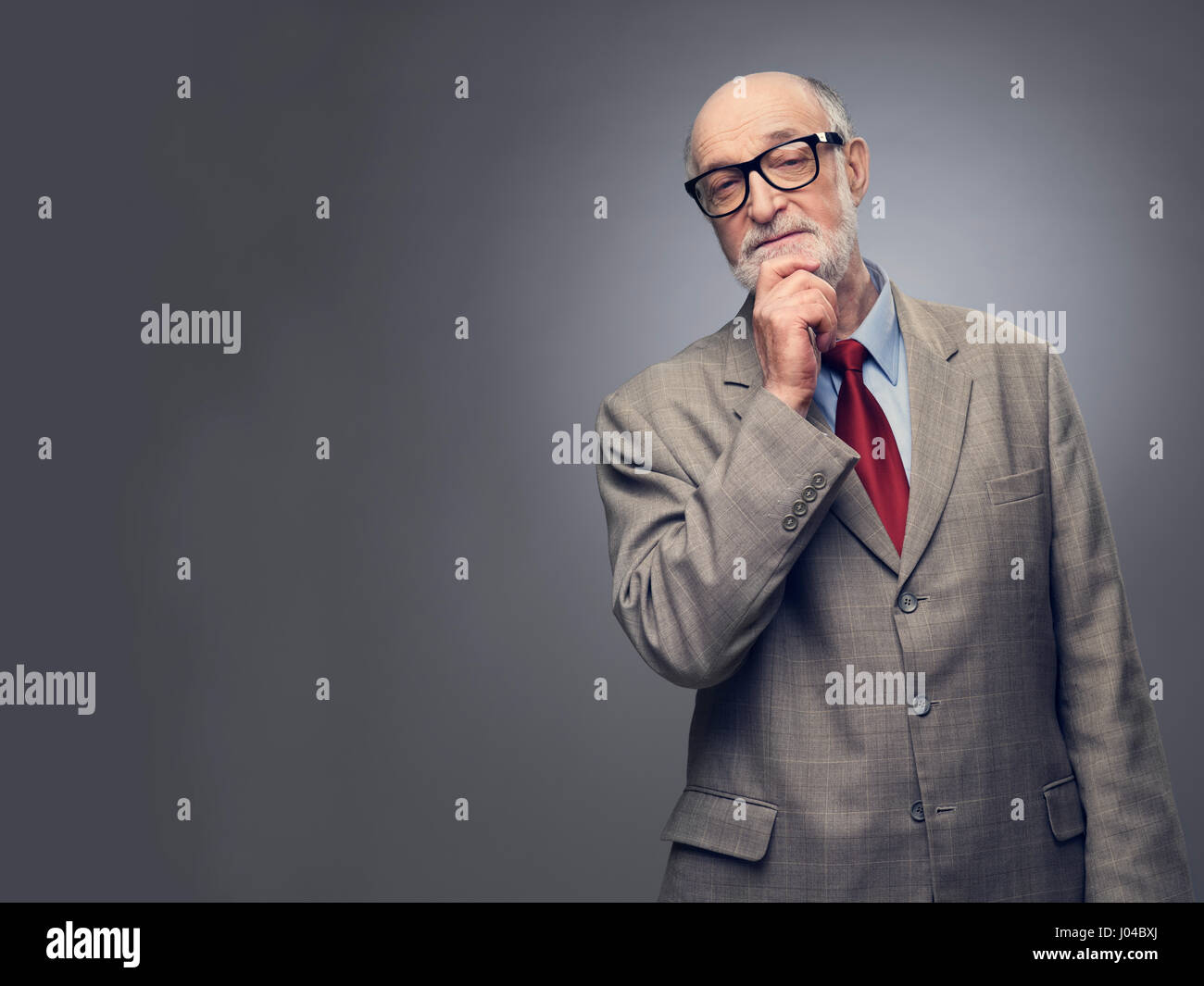 Man with hand on chin hi-res stock photography and images - Alamy