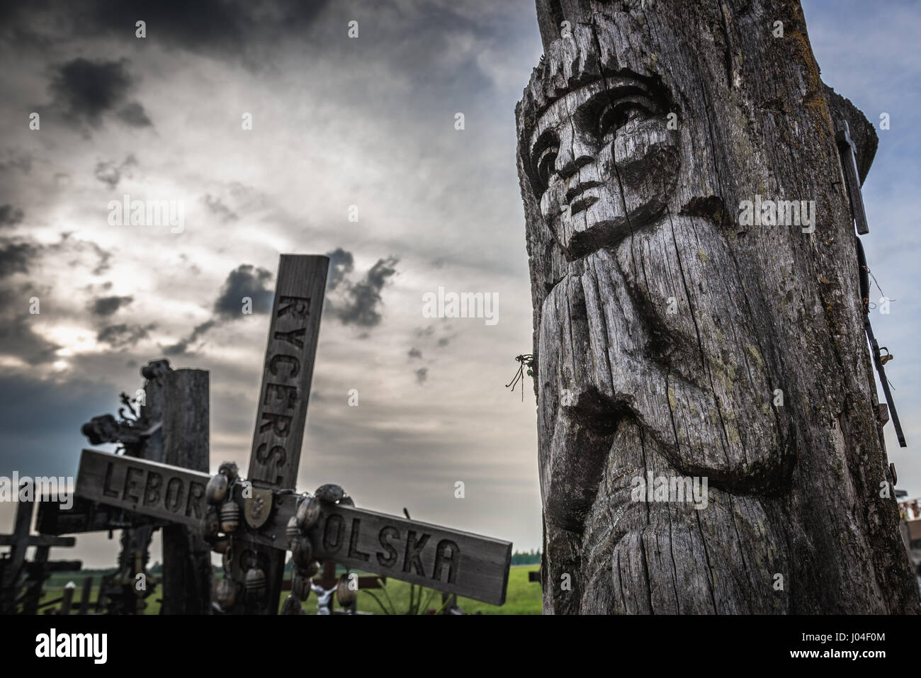 Wooden sculpture on Hill of Crosses in Lithuania Stock Photo