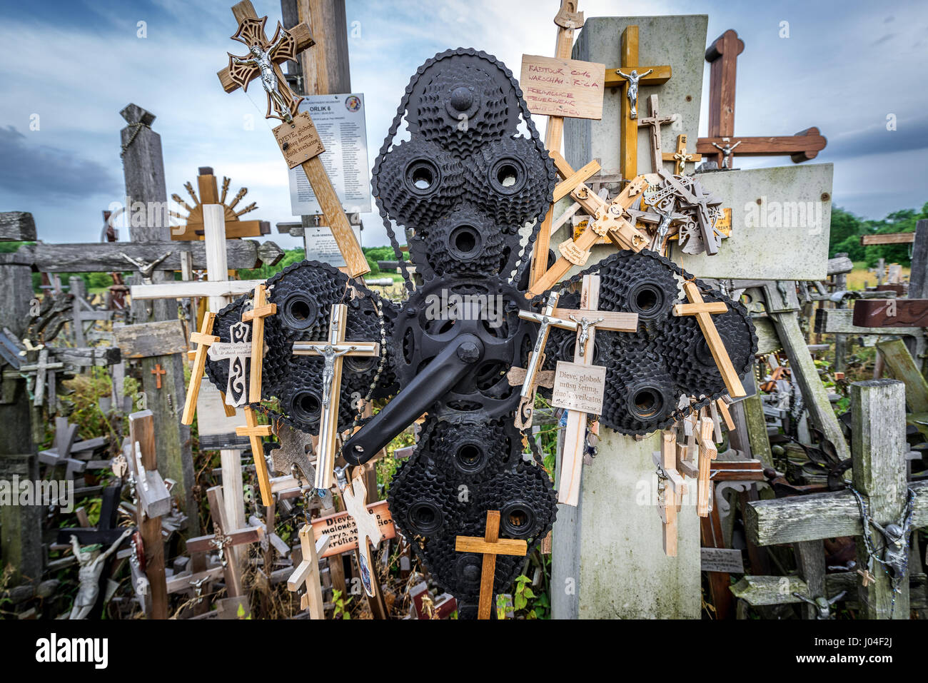 Cross made of toothed wheels on Hill of Crosses in Lithuania Stock Photo