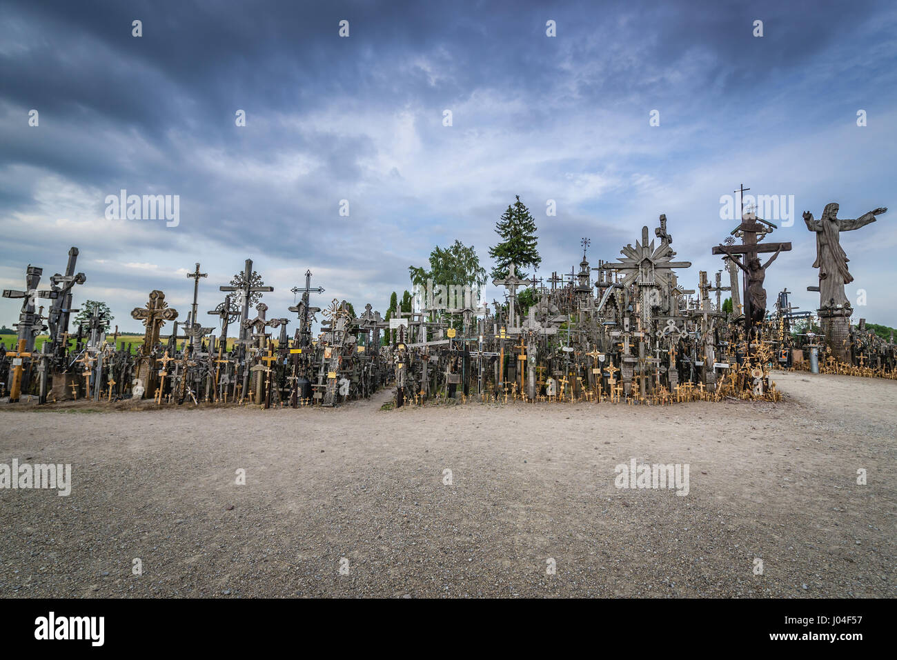 Large crosses and Jesus statue on Hill of Crosses in Lithuania Stock Photo