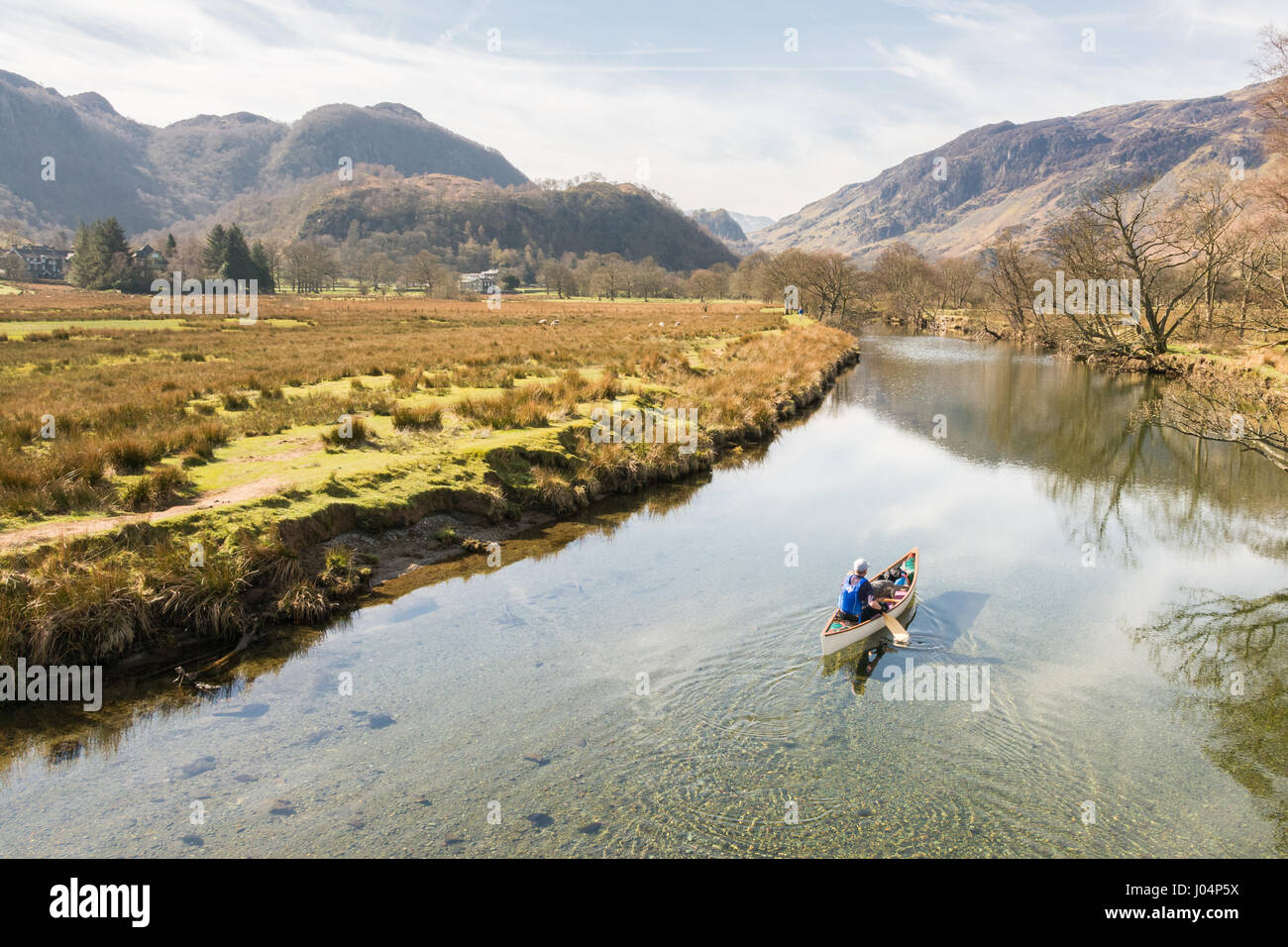 Canoeing Canoe in the Lake District, England, UK one man and his dog