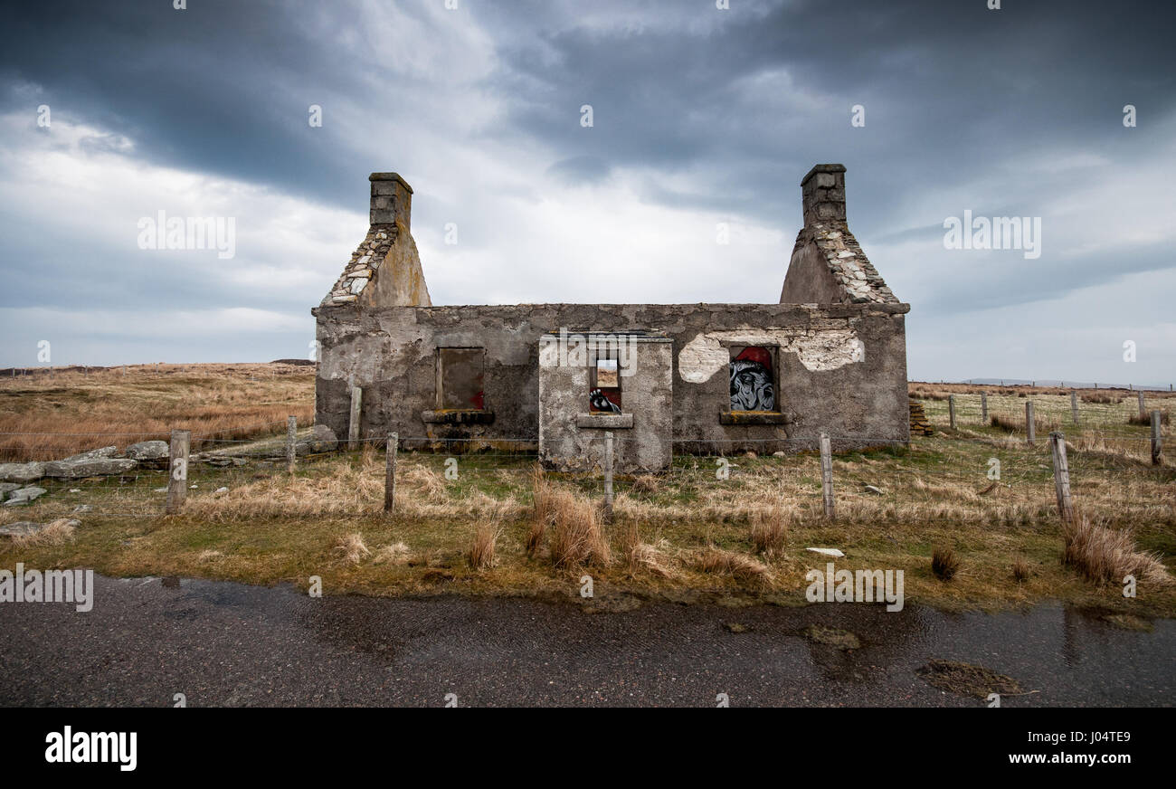 The Moine House, the ruin of a traditional stone cottage on bleak and remote moorland in Sutherland in the far north of the Highlands of Scotland. The Stock Photo
