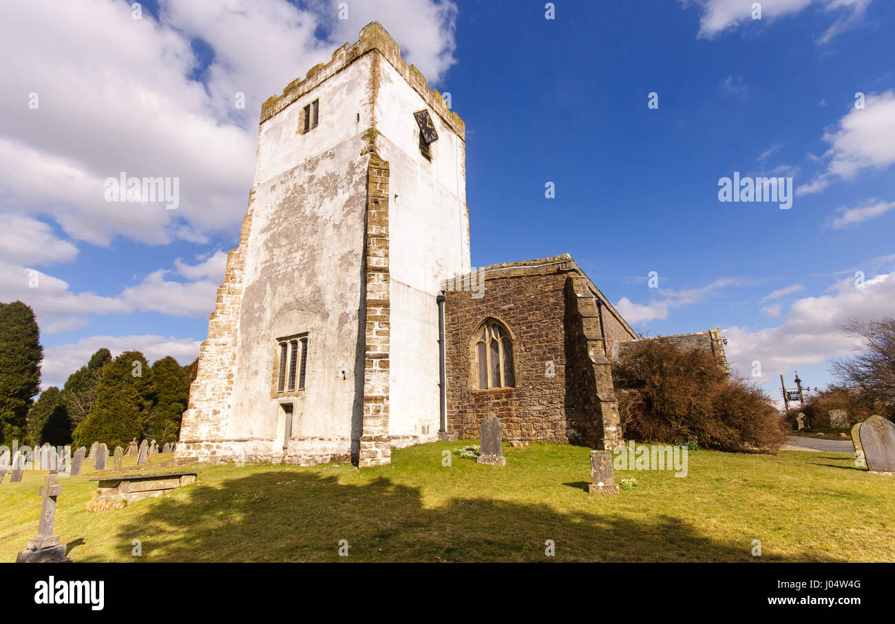 Cumbria, England - March 30, 2013: The whitewashed church tower in the village of Orton in the Eden district of Cumbria. Stock Photo