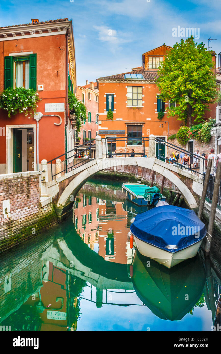 Beautiful scene with colorful houses and boats on a small channel in Venice, Italy Stock Photo