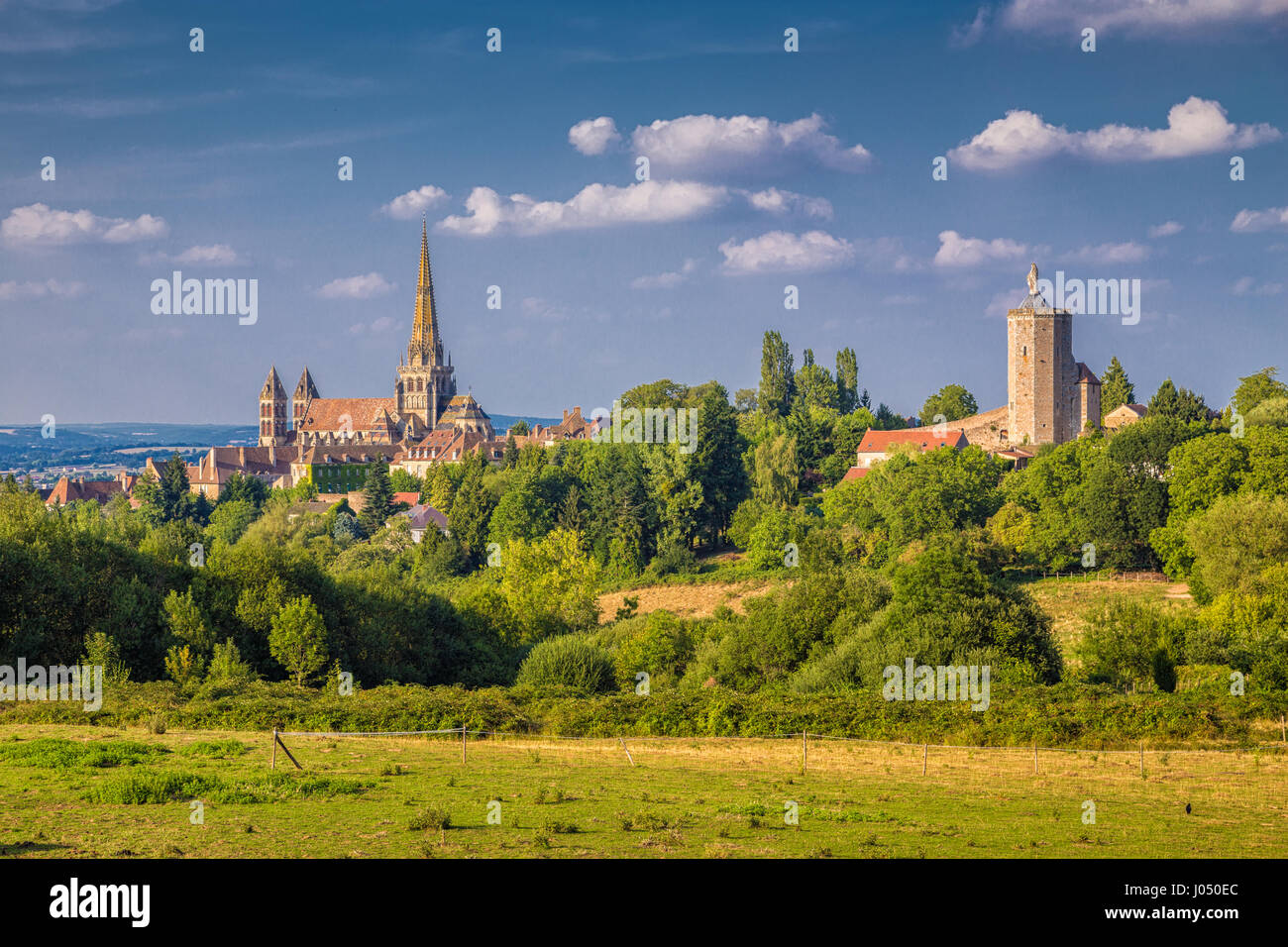 Historic town of Autun with famous Cathedrale Saint-Lazare d'Autun on top of a hill in evening light at sunset, Saone-et-Loire, Burgundy, France Stock Photo