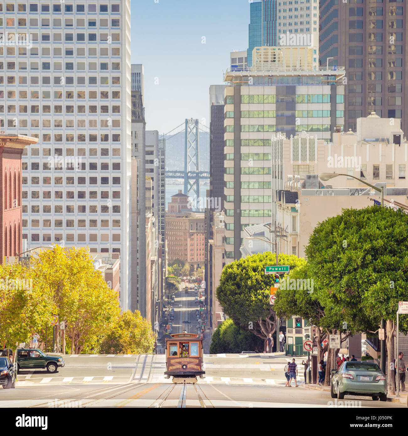 Classic view of historic traditional Cable Car riding on famous California Street in beautiful evening light at sunset in summer, San Francisco, USA Stock Photo
