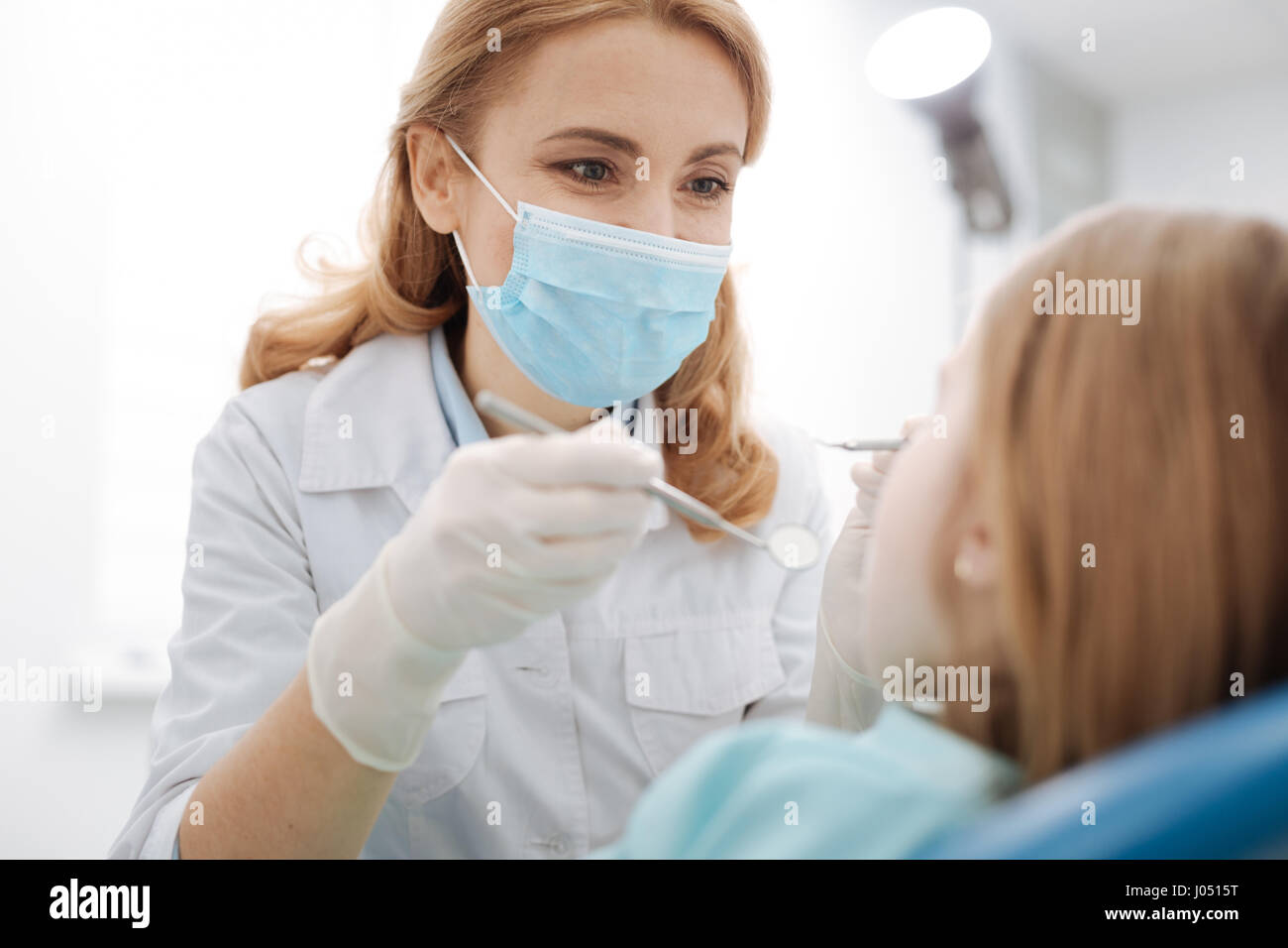 Sweet lovely doctor doing a routine checkup Stock Photo