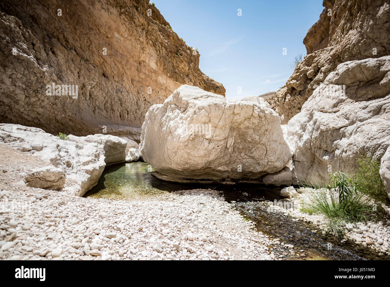 Large stones on the river going thru the canyon of Wadi Bani Khalid, Sultanate of Oman. This is one of the most visited place of the country Stock Photo