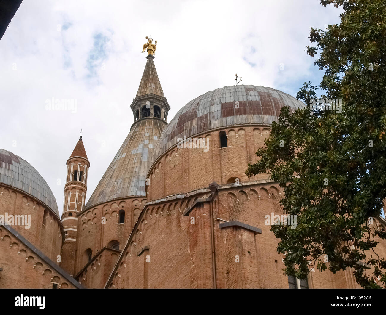 Padova, Italy - May 16, 2016: Basilica of Saint Anthony of Padua view from the cloister of the abbey to the courtyard. The cloister, built in the late Stock Photo