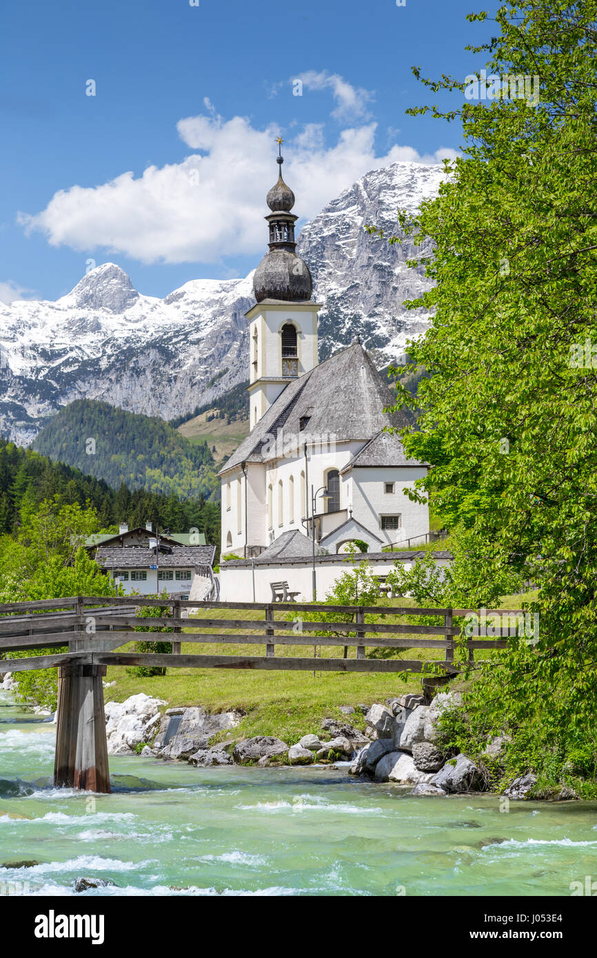 Scenic mountain landscape in the Bavarian Alps with famous Parish Church of St. Sebastian in the village of Ramsau in springtime, Bavaria, Germany Stock Photo