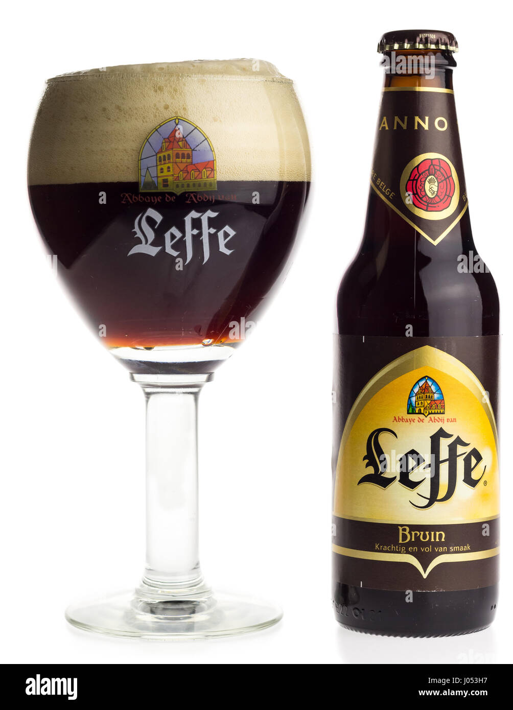 Bottle and glass of Belgian Leffe Bruin beer isolated on a white