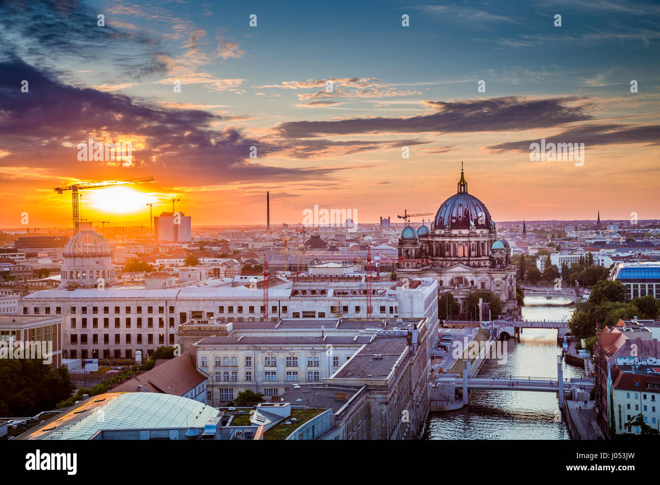 Aerial view of Berlin skyline with famous Berlin Cathedral and Spree river in beautiful golden evening light with clouds at sunset with retro vintage  Stock Photo