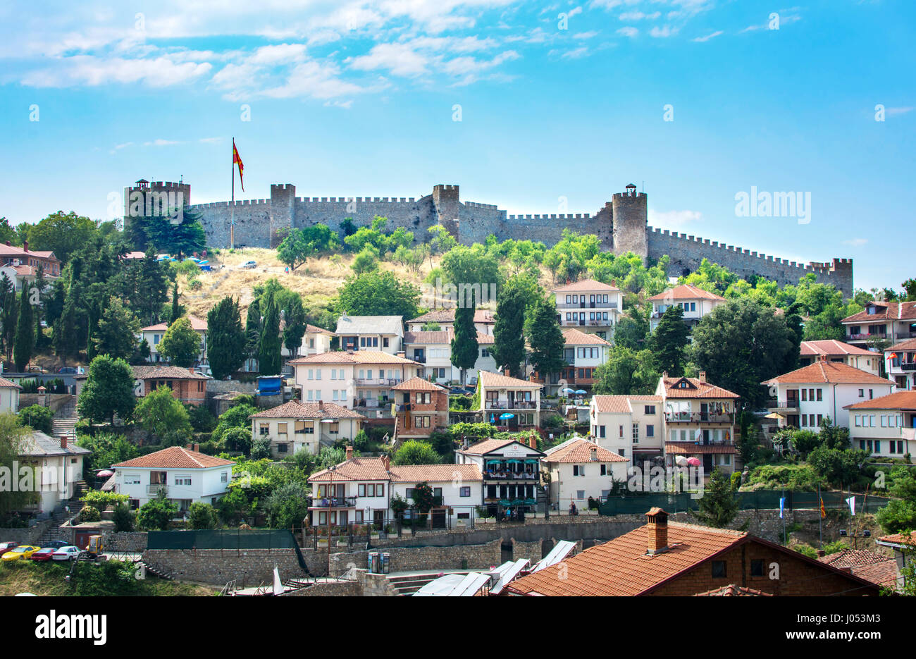 OHRID, REP. OF MACEDONIA - AUGUST 6, 2016: The walls of Samuel Fortress above old houses of Ohrid old town Stock Photo