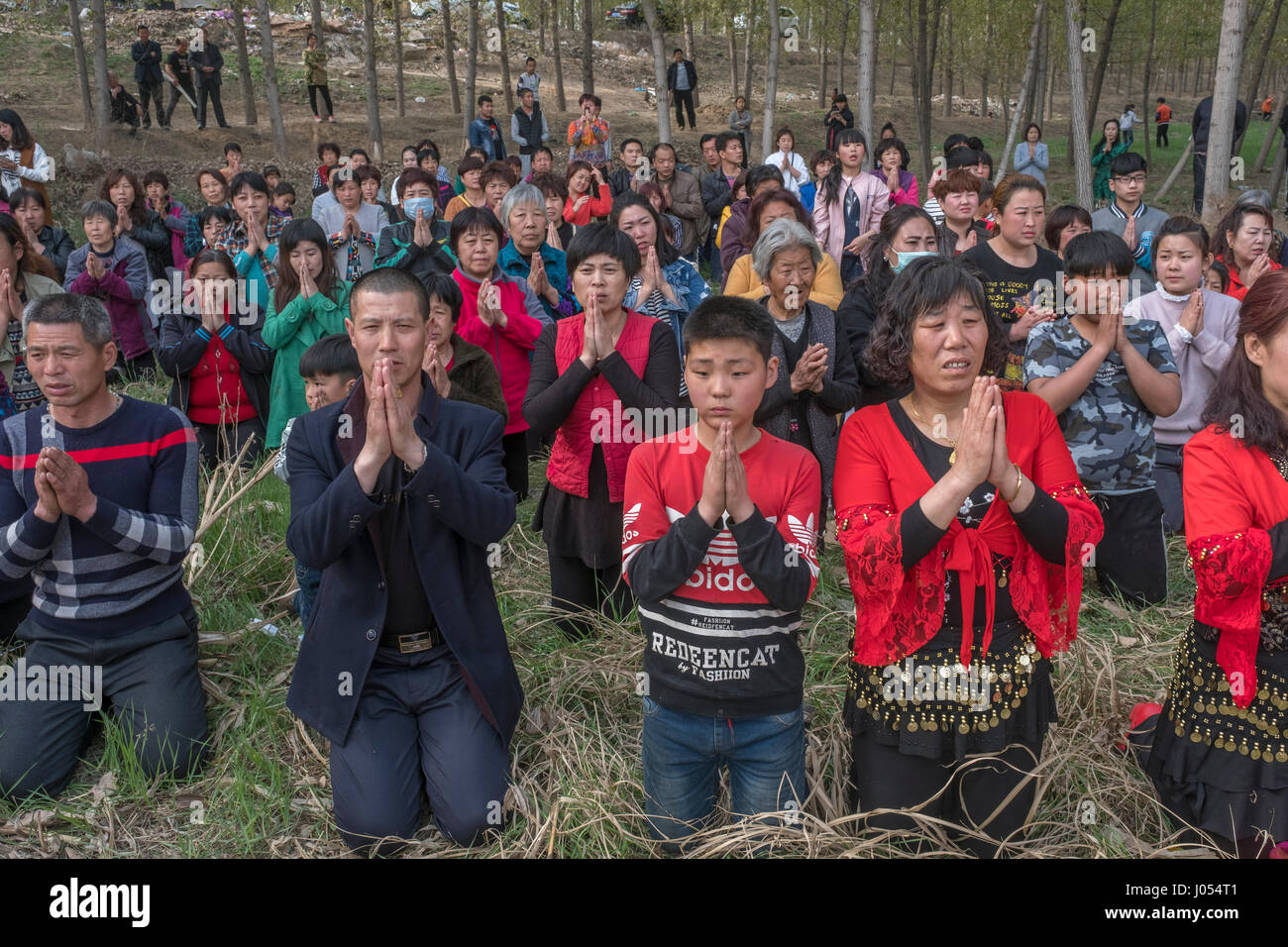 Local villagers pray while attending an annual Taoism ceremony to celebrate the birthday of Bixia Yuanjun, known as the 'Lady of Mount Tai”, one of the most important Taoism goddesses in Northern China, in Liutong village, Rongcheng county, one of the three counties composing Xiongan New Area in Hebei Province, China on April 09, 2017. With Chinese government suddenly announced the location of the special economic zone (SEZ) which would effectively serve as an extension of capital Beijing one week ago, such ceremony of Liutong maybe the last one. Credit: Lou Linwei/Alamy Live News Stock Photo