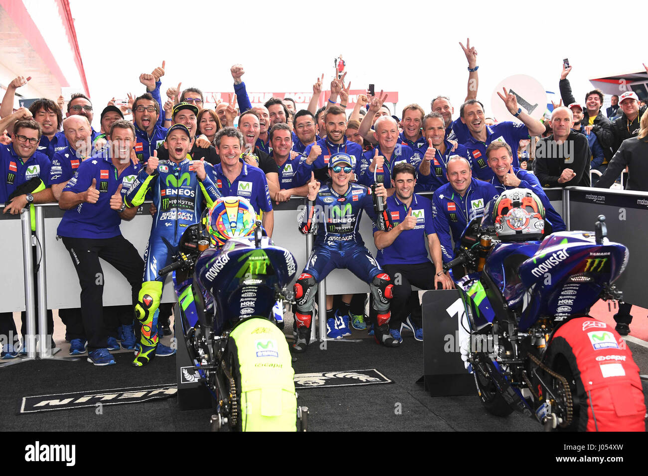 RIO HONDO-APRIL 9, Valentino Rossi of Italy and Movistar Yamaha MotoGP and  Maverick Vinales of Spain and Movistar Yamaha MotoGP celebrating together  with their team under the podio during the MotoGp Race