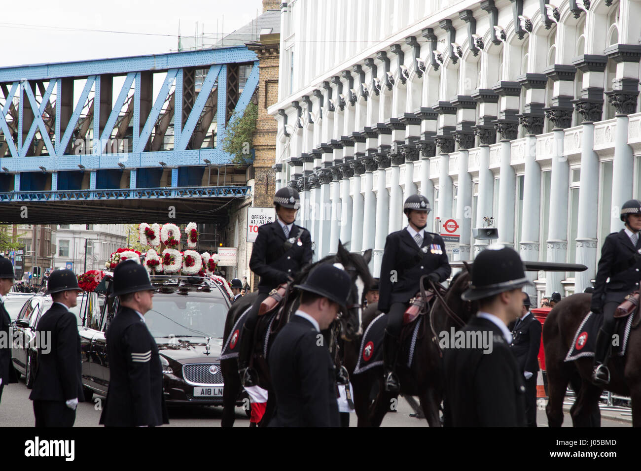 London, UK. 10th Apr, 2017. Police officers line the route in Southwark as the funeral procession of PC Keith Palmer makes its way to Southwark Cathedral. Credit: Thabo Jaiyesimi/Alamy Live News Stock Photo