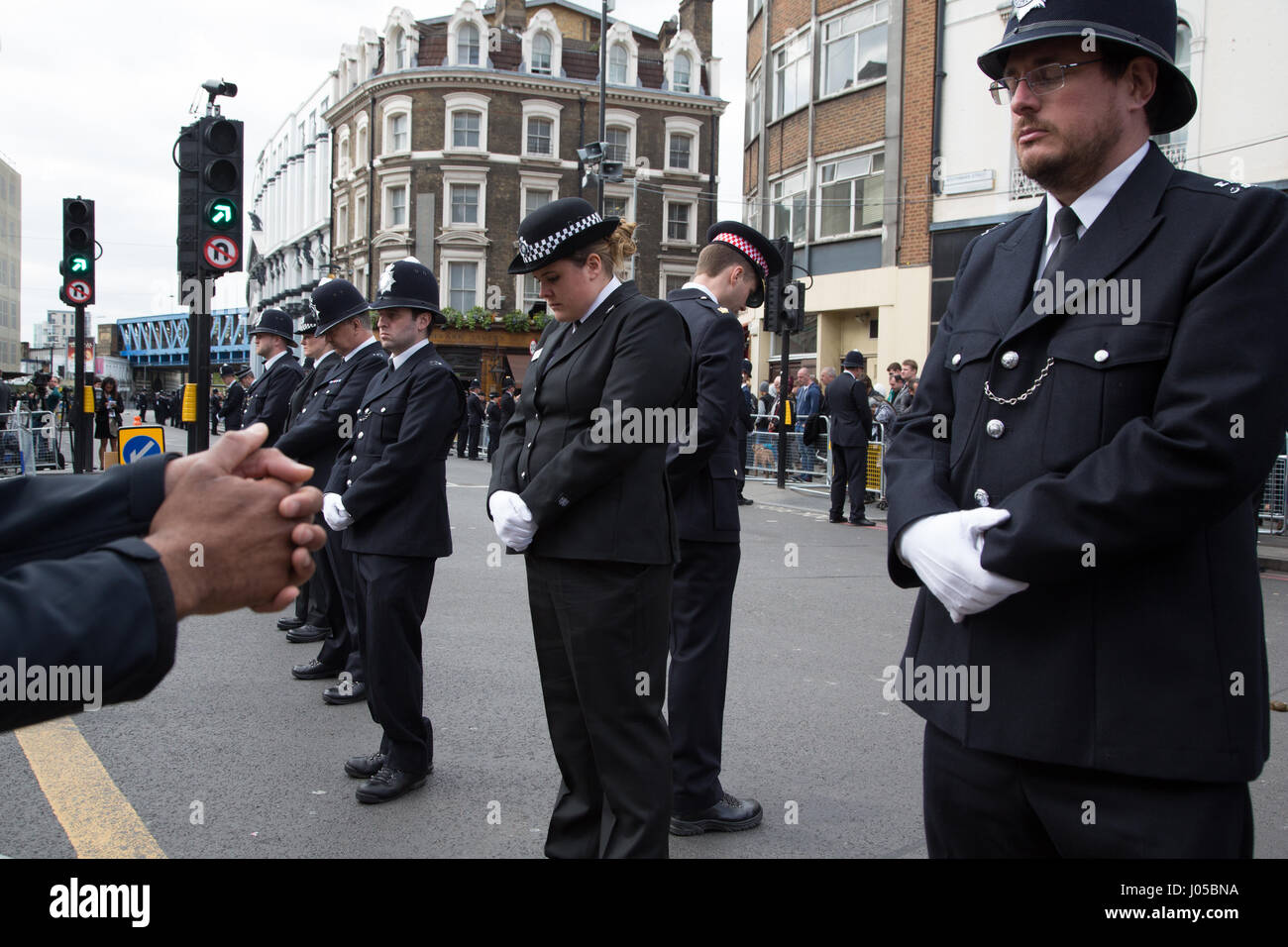 London, UK. 10th Apr, 2017. Police officers line the route in Southwark as the funeral procession of PC Keith Palmer makes its way to Southwark Cathedral. Credit: Thabo Jaiyesimi/Alamy Live News Stock Photo