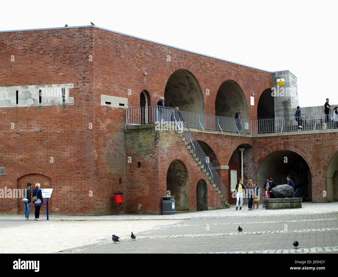 Tourists visiting the old sea walls at Broad Street, Old Portsmouth