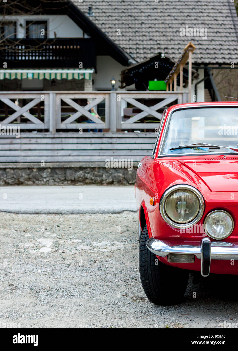 red retro car in the countryside Stock Photo