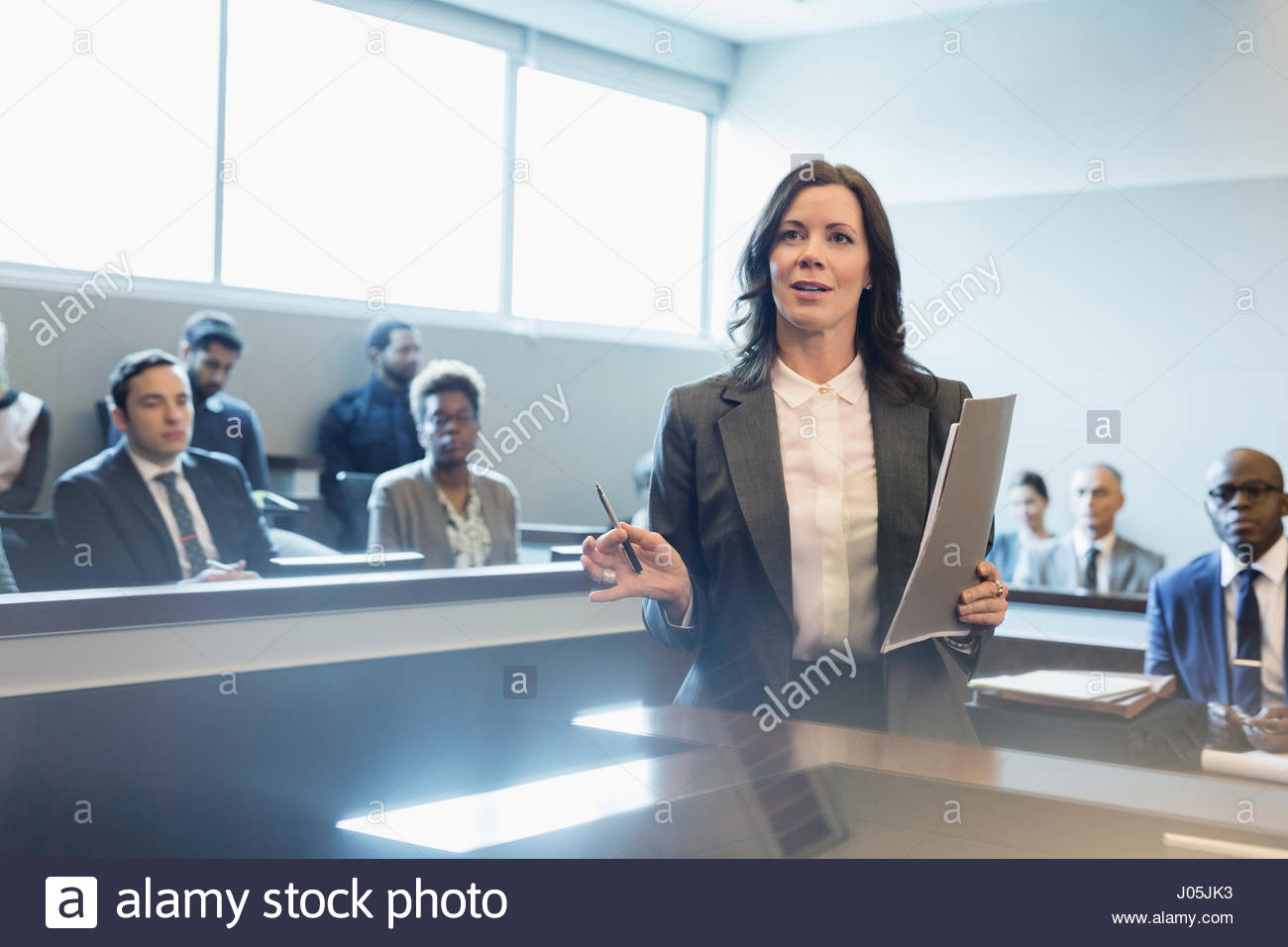 Female attorney talking in legal trial courtroom Stock Photo