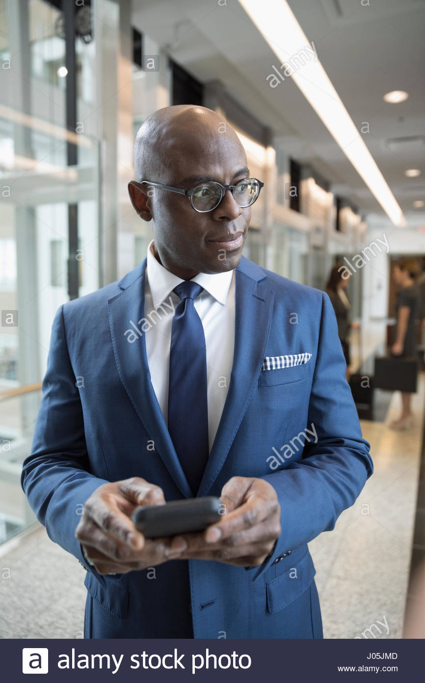 Male attorney using cell phone in courthouse corridor Stock Photo Alamy