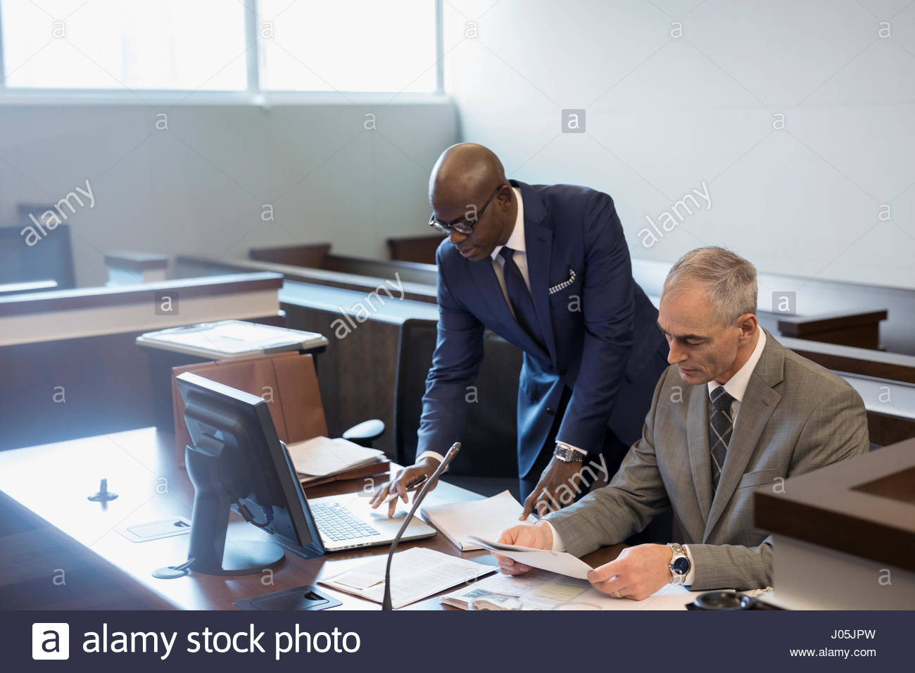Male prosecutor attorneys working in courtroom Stock Photo Alamy