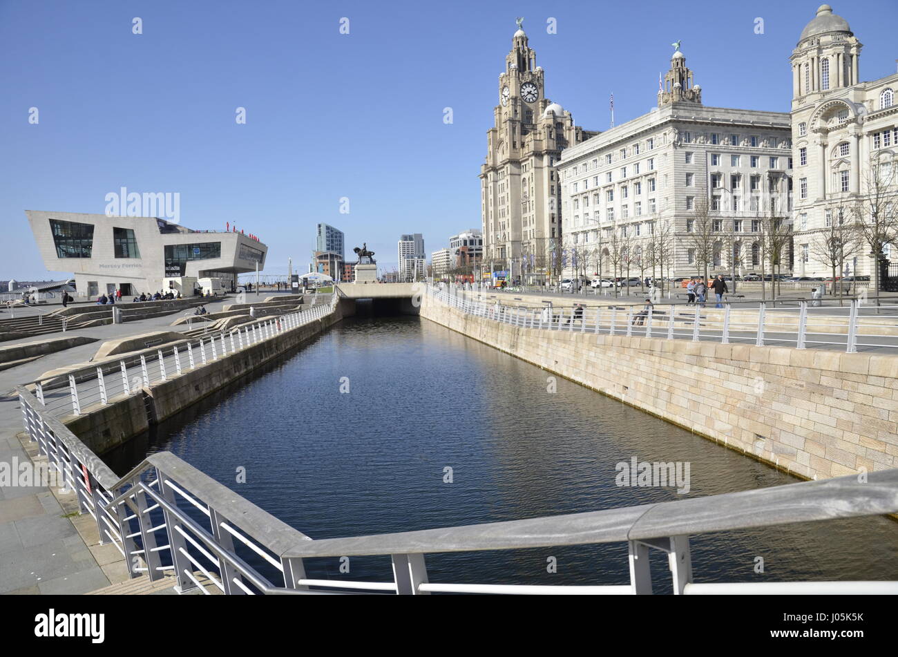 The Mersey Ferries building on Pier Head area on the River Mersey in Liverpool. The Liver, Cunard and Port of Liverpool buildings are to the right Stock Photo