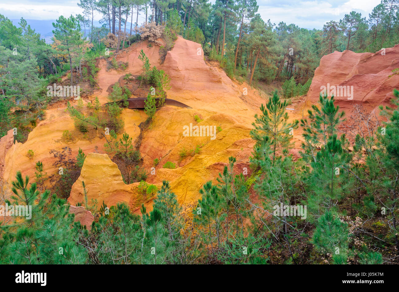Provence Rocks Colorful rocks made of ochre near the hilltop village of Rousillon ...