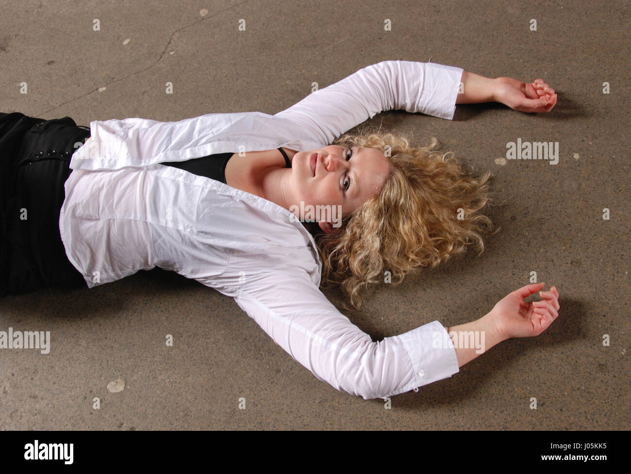 Blonde girl on the floor Stock Photo - Alamy